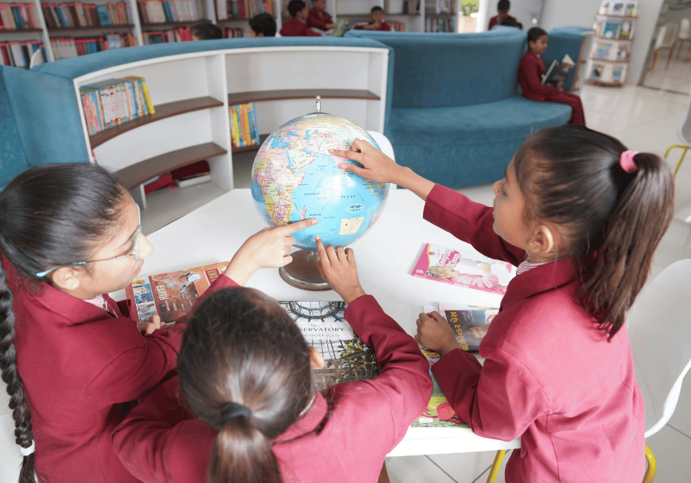 Family exploring world map